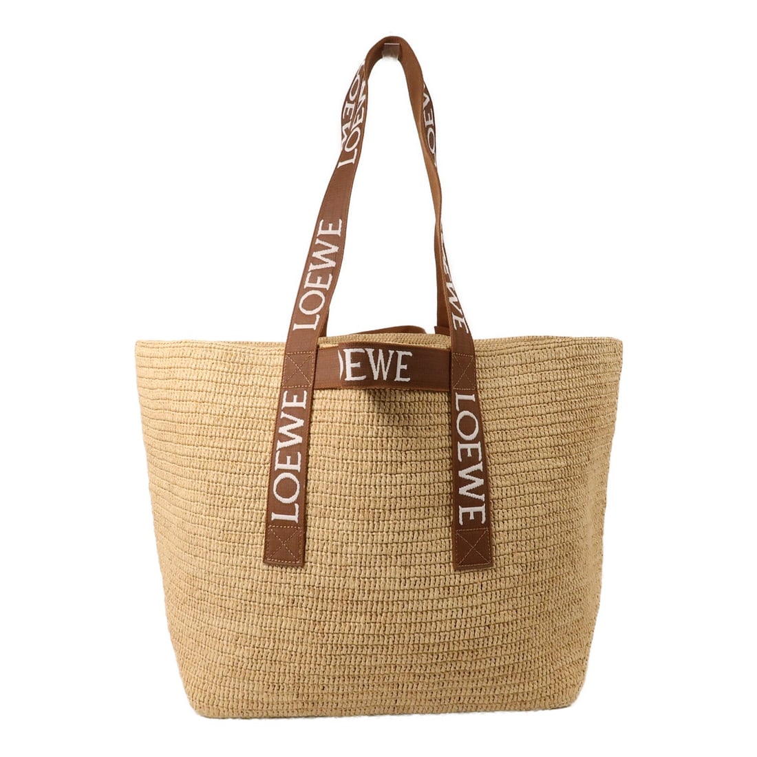 LOEWE Raffia Fold Tote Brown Shopper: LOEWE Raffia Fold Tote Brown Shopper This LOEWE Fold Shopper tote bag features a stylish raffia exterior in brown, offering a spacious and versatile design. Crafted in Spain, it is designed for women 