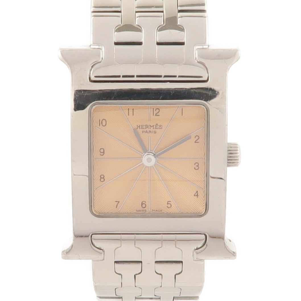 Hermes H Quartz Stainless Steel Women's Wristwatch HH1.210 Gold Tone: Hermes H Quartz Stainless Steel Women's Wristwatch HH1.210 Gold Tone This Hermes H Watch HH1.210 is a women's wristwatch featuring a stainless steel case and band with a gold-tone finish. It is powere