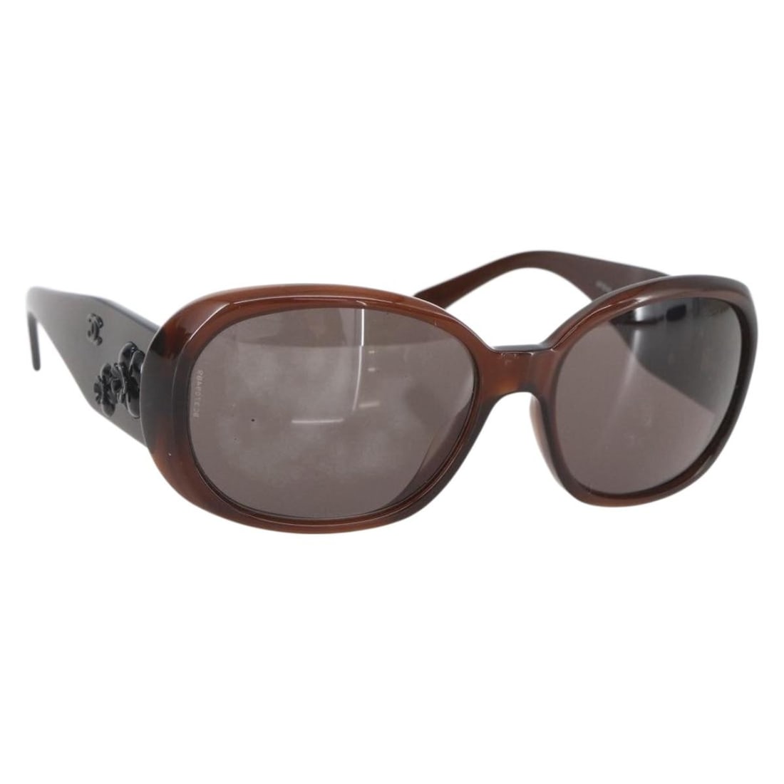 CHANEL Camelia Brown Plastic Sunglasses with CC Logo and Case: CHANEL Camelia Brown Plastic Sunglasses with CC Logo and Case These CHANEL Camelia sunglasses feature a brown plastic frame and the signature CC logo. Made in Italy, they come with a dust bag and sung