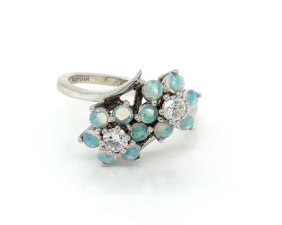 14k White Gold Opal Diamond Double Flower Ring Size 5.5: 14k White Gold Opal Diamond Double Flower Ring Size 5.5 This vintage double flower ring features two floral motifs crafted in solid 14k white gold. Each flower is formed by fiery opal petals, with spa