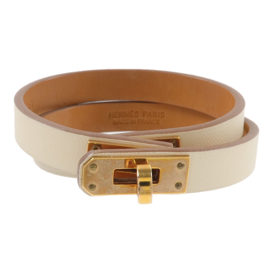 Hermes Mini Kelly Double Tour White Leather Bracelet GHW: Hermes Mini Kelly Double Tour White Leather Bracelet GHW This Hermes Mini Kelly Double Tour bracelet is crafted from Swift calfskin leather in a white (Nata) color. Designed for women, it features a s