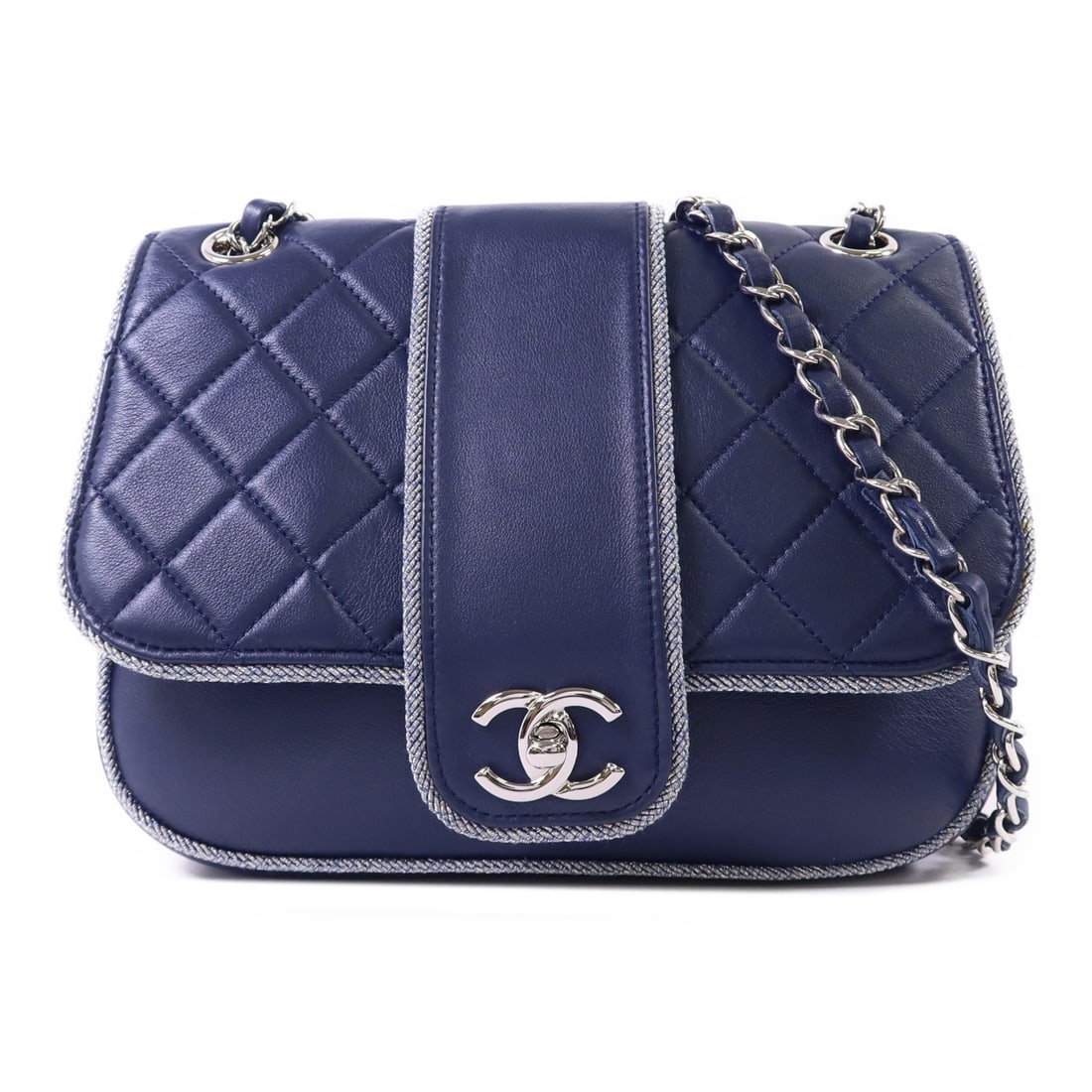 Navy Lambskin CHANEL Shoulder Bag with CC Silver Hardware: Navy Lambskin CHANEL Shoulder Bag with CC Silver Hardware This CHANEL CC shoulder bag is crafted from navy blue lambskin leather and features silver-tone hardware. Designed in a classic chain style, i