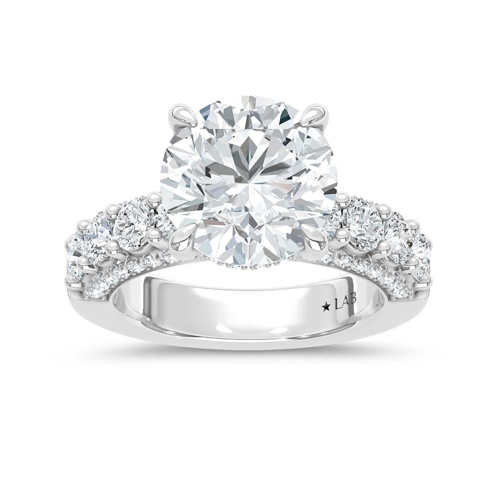 14K White Gold Lab Grown Diamond 6 7/8 Ct.Tw. Engagement Ring (Center 5ct): 14K White Gold Lab Grown Diamond 6 7/8 Ct.Tw. Engagement Ring (Center 5ct) Discover subtle brilliance and modern elegance with our Hidden Halo Diamond Engagement Ring. This elegant engagement ring fea
