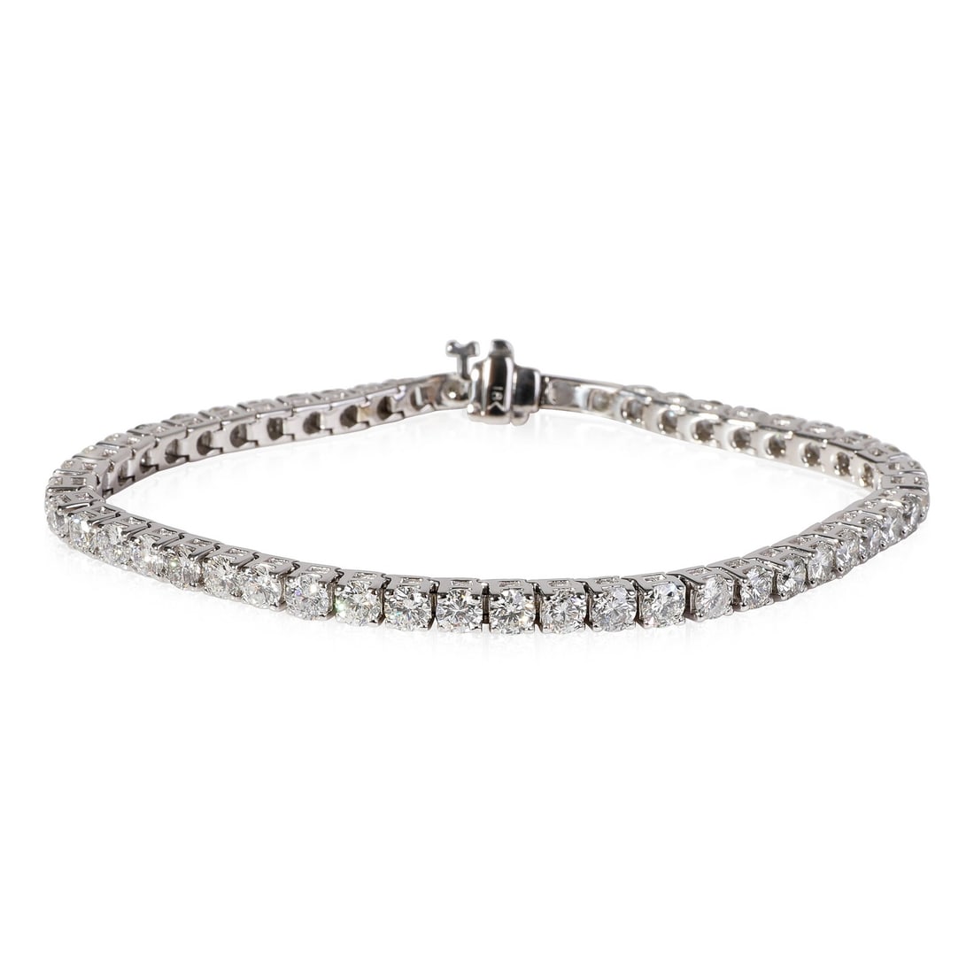 7 Inch 18k White Gold Tennis Bracelet With 7.25 Carat Diamonds: 7 Inch 18k White Gold Tennis Bracelet With 7.25 Carat Diamonds This pre-owned tennis bracelet features round brilliant cut white diamonds with a total carat weight of 7.25, set in 18k white gold. Desi
