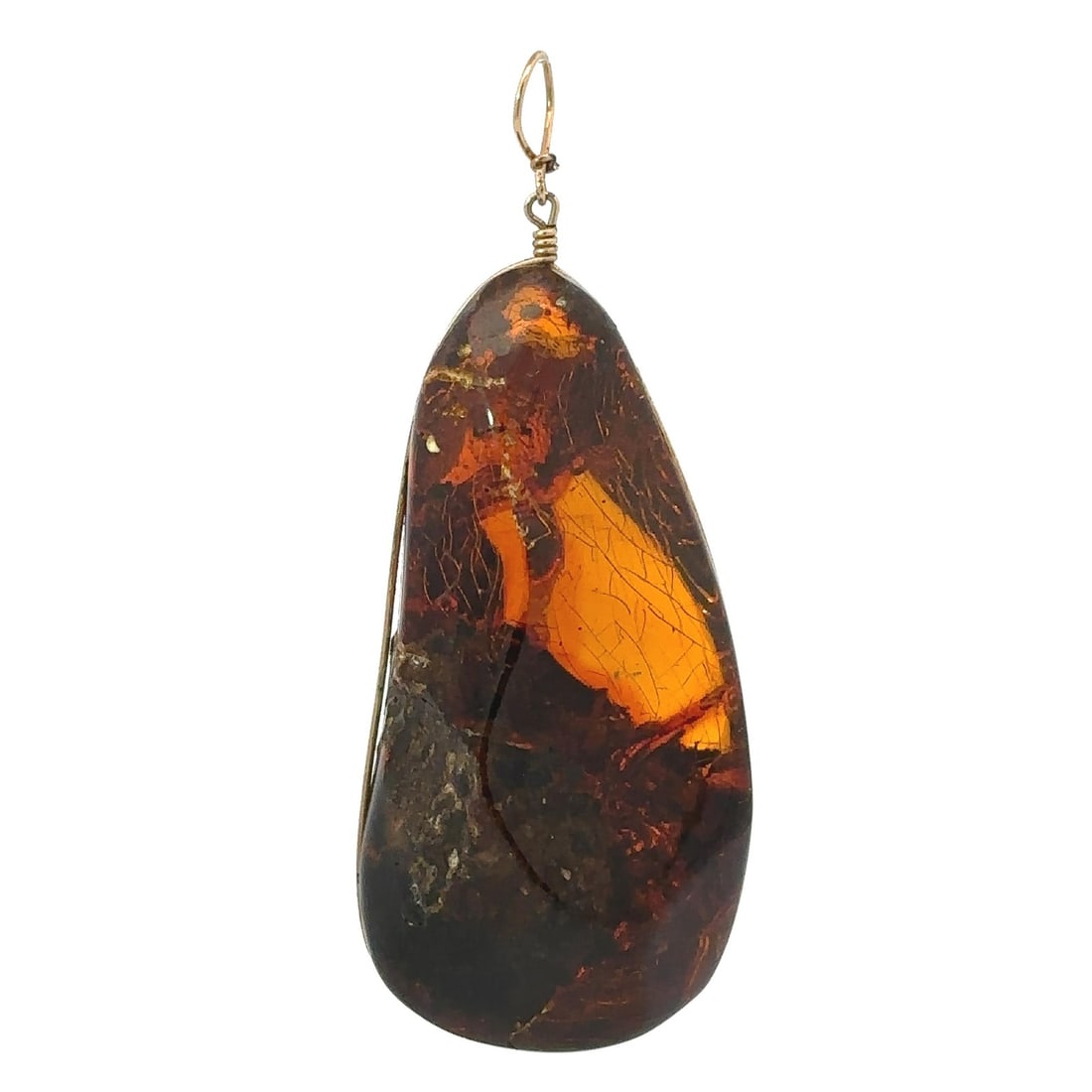 Vintage Large Freeform Baltic Amber Pendant Natural Brown 55.8x25mm: Vintage Large Freeform Baltic Amber Pendant Natural Brown 55.8x25mm This stunning vintage pendant showcases a large, freeform Baltic amber stone with a rich orangy-brown hue. The natural amber measure