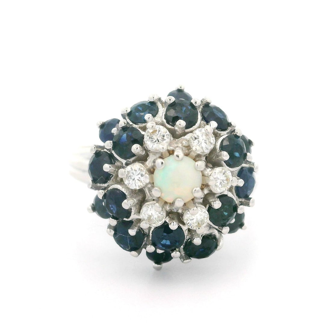 Vintage 14k White Gold Opal Diamond Sapphire Cocktail Ring: Vintage 14k White Gold Opal Diamond Sapphire Cocktail Ring This stunning vintage cocktail ring features a captivating waterfall pyramid design, crafted in 14k white gold. The main stone is a natural g