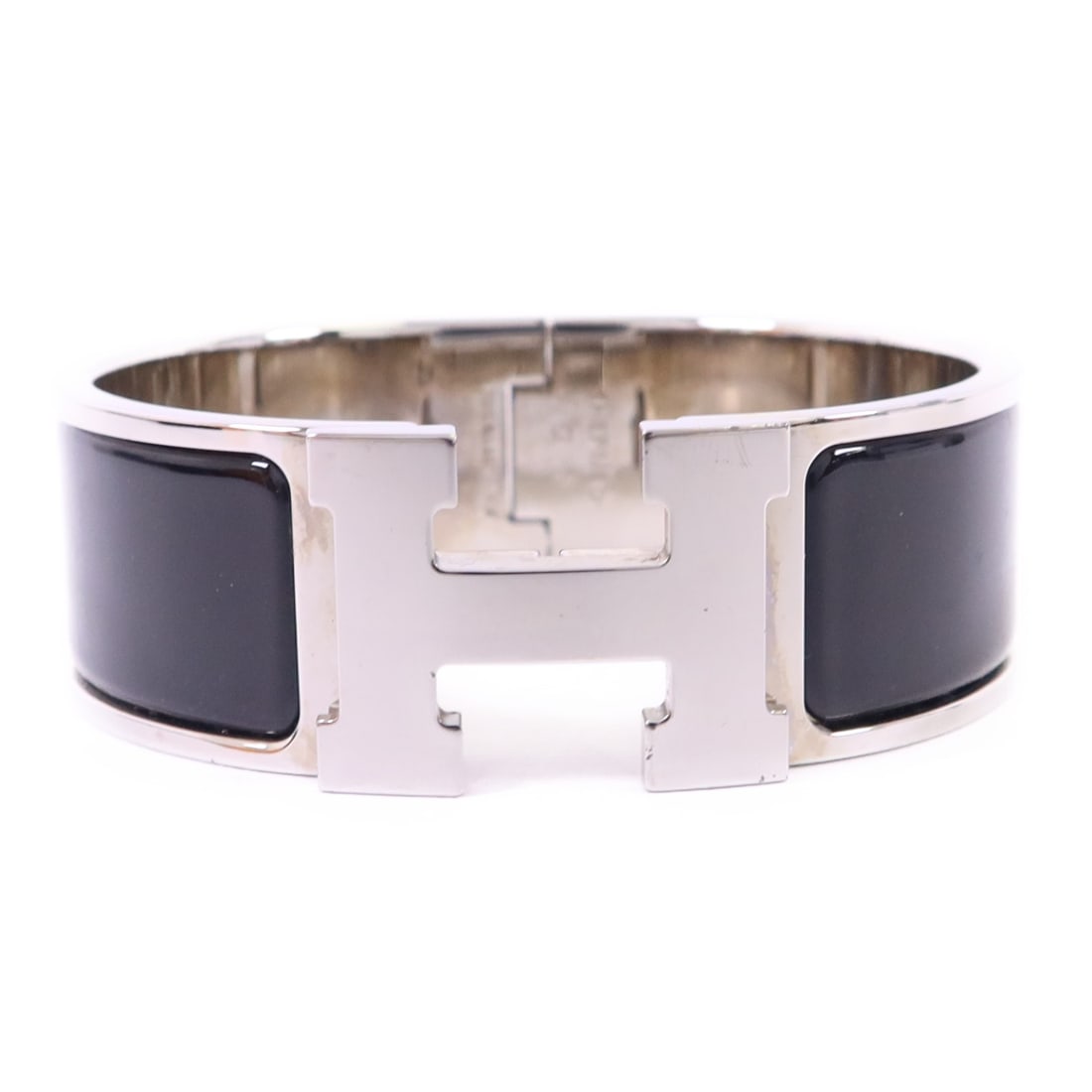 Hermes Clic-Clac H Black and Silver Tone Metal Bangle Bracelet: Hermes Clic-Clac H Black and Silver Tone Metal Bangle Bracelet This Hermes Clic-Clac H bangle features a striking black color with silver-tone metal accents. Crafted in France, the bangle showcases a 