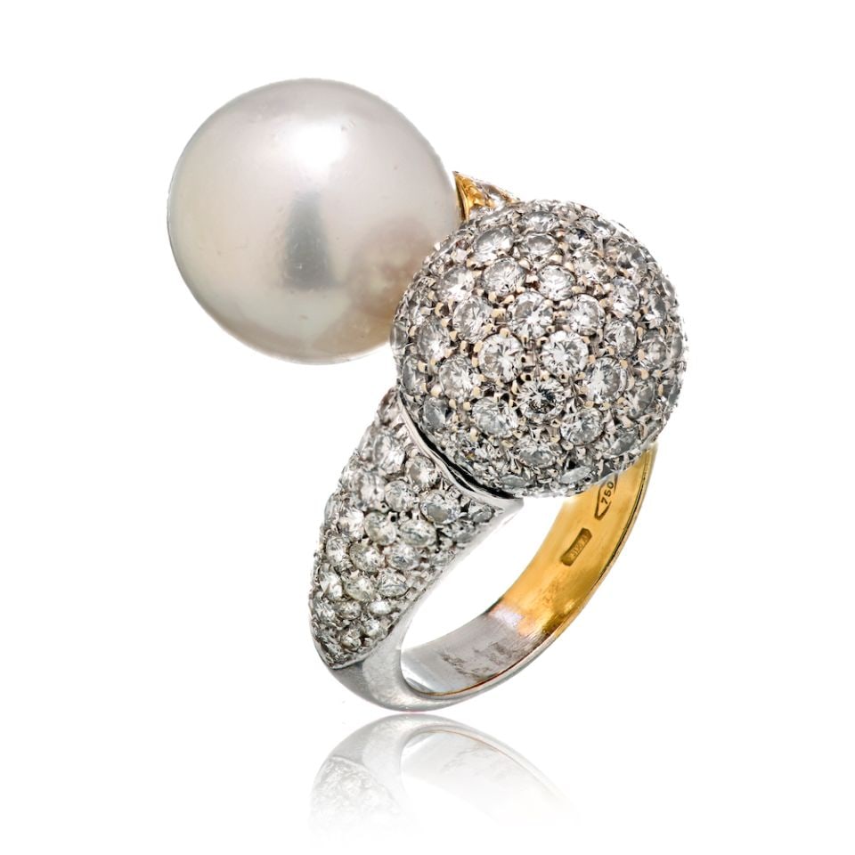 Vintage 18K Two Tone Gold Diamond and South Sea Pearl Bypass Ring: Vintage 18K Two Tone Gold Diamond and South Sea Pearl Bypass Ring This vintage bypass ring from the 1960s features a striking two-tone 18K gold design. The ring showcases a pave-set diamond ball with 