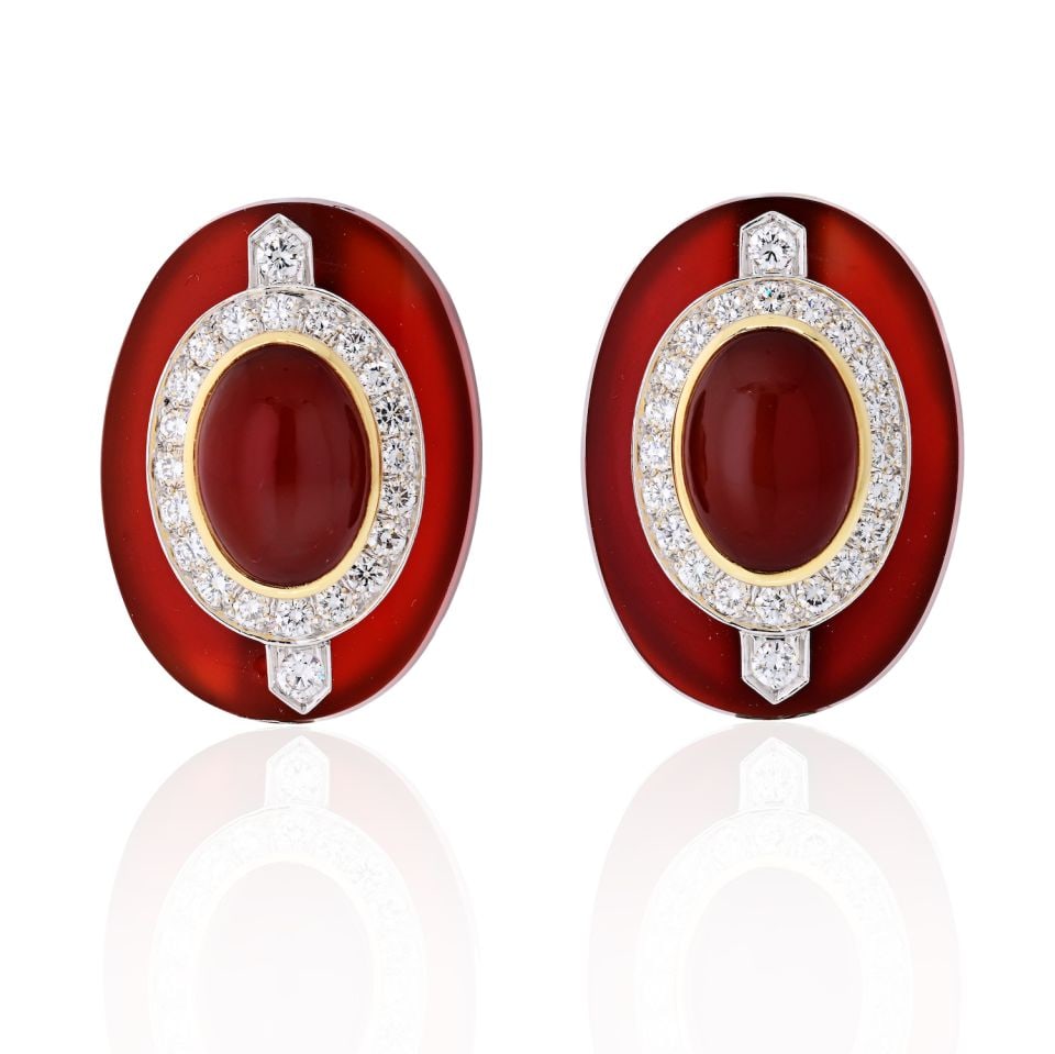 David Webb Carnelian Diamond Platinum 18K Gold Clip Earrings: David Webb Carnelian Diamond Platinum 18K Gold Clip Earrings These stunning David Webb earrings showcase a luxurious combination of platinum and 18K yellow gold. Featuring two exquisite oval cabochon 