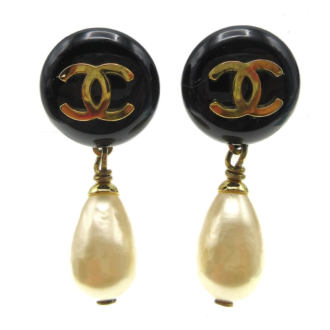 Chanel 94P Black Dangle Earrings with Clip-On Closure and Artificial Pearls: Chanel 94P Black Dangle Earrings with Clip-On Closure and Artificial Pearls Enhance your accessory collection with these exquisite Chanel dangle earrings. Featuring a classic clip-on closure, these ea