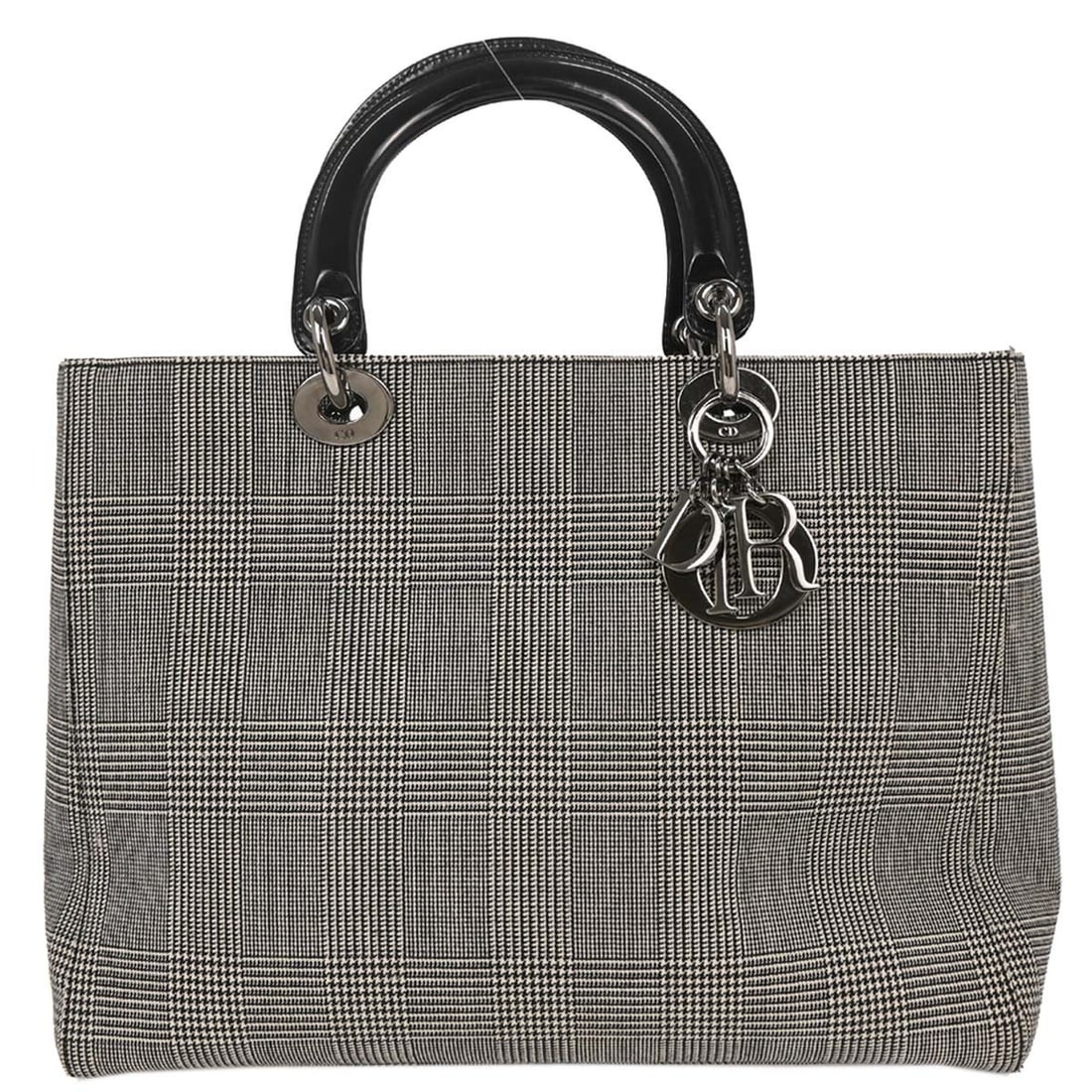 Lady Dior Houndstooth Canvas Vintage Handbag by Christian Dior: Lady Dior Houndstooth Canvas Vintage Handbag by Christian Dior This vintage Lady Dior handbag features a classic houndstooth canvas design in black. Crafted for women, the bag is made from canvas and 