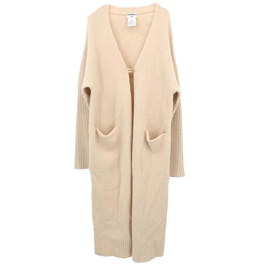 CHANEL Beige Wool Knit Long Sleeve Cardigan FR 40: CHANEL Beige Wool Knit Long Sleeve Cardigan FR 40 This vintage Chanel long cardigan is crafted from 100% wool in a classic beige color. Designed with a knit construction, it features long sleeves, a r
