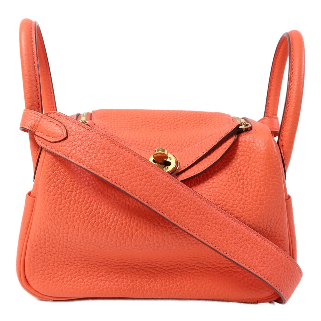 Hermes Mini Lindy Rouge Tomate Clemence Leather Shoulder Bag with Gold Hardware: Hermes Mini Lindy Rouge Tomate Clemence Leather Shoulder Bag with Gold Hardware This Mini Lindy 2-way shoulder bag is crafted from Clemence calfskin leather in a vibrant orange hue. Featuring a versat