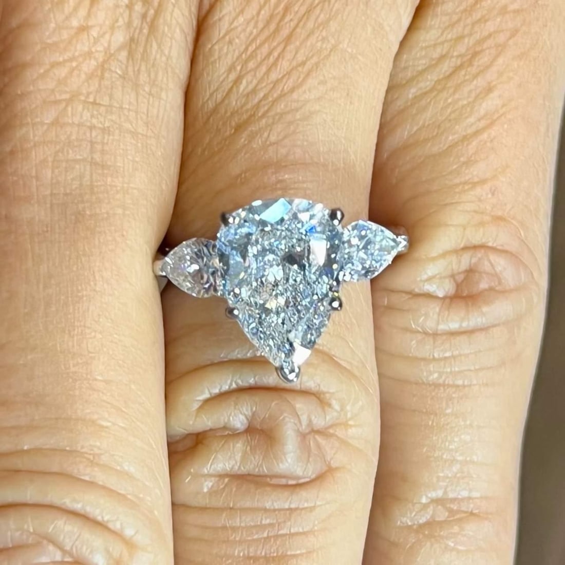 GIA Certified 4.02 Ct. Pear Diamond Platinum Engagement Ring: GIA Certified 4.02 Ct. Pear Diamond Platinum Engagement Ring This exquisite engagement ring features a stunning 4.02 Ct. pear shape diamond, certified by GIA, with E color and SI2 clarity. Crafted in 