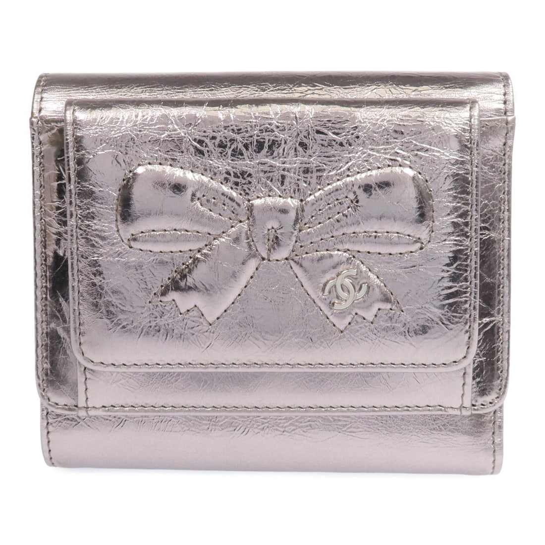 Tri-fold Calfskin Wallet by CHANEL in Silver with CC Logo: Tri-fold Calfskin Wallet by CHANEL in Silver with CC Logo This CHANEL tri-fold wallet features luxurious calfskin leather in a sleek silver color. Designed for both functionality and style, it is craf