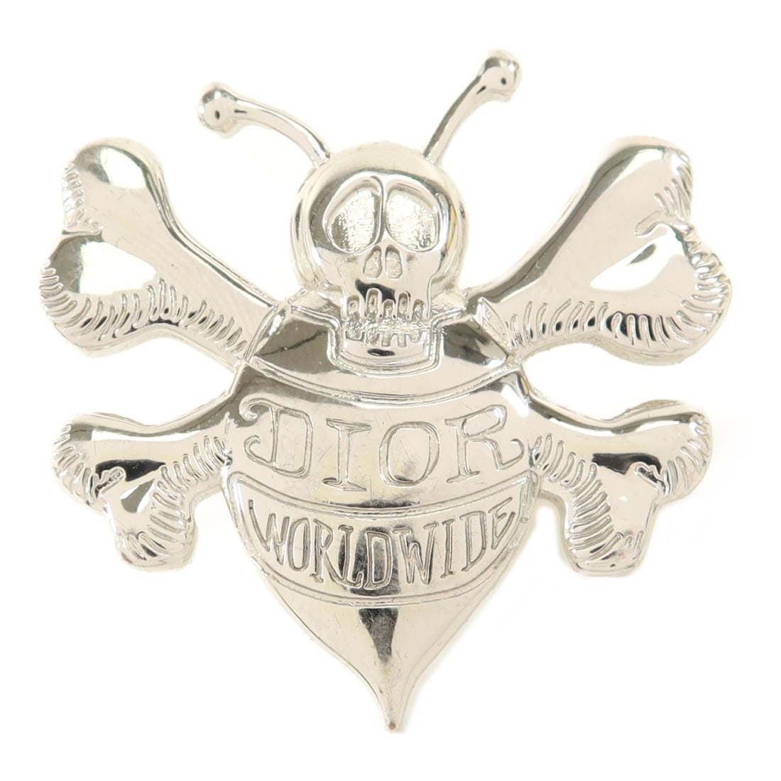 Dior Silver Metal CD Brooch: Dior Silver Metal CD Brooch This Christian Dior brooch features a silver-tone metal design, offering a stylish accessory for women. Crafted in France, it is designed without any stones and displays th