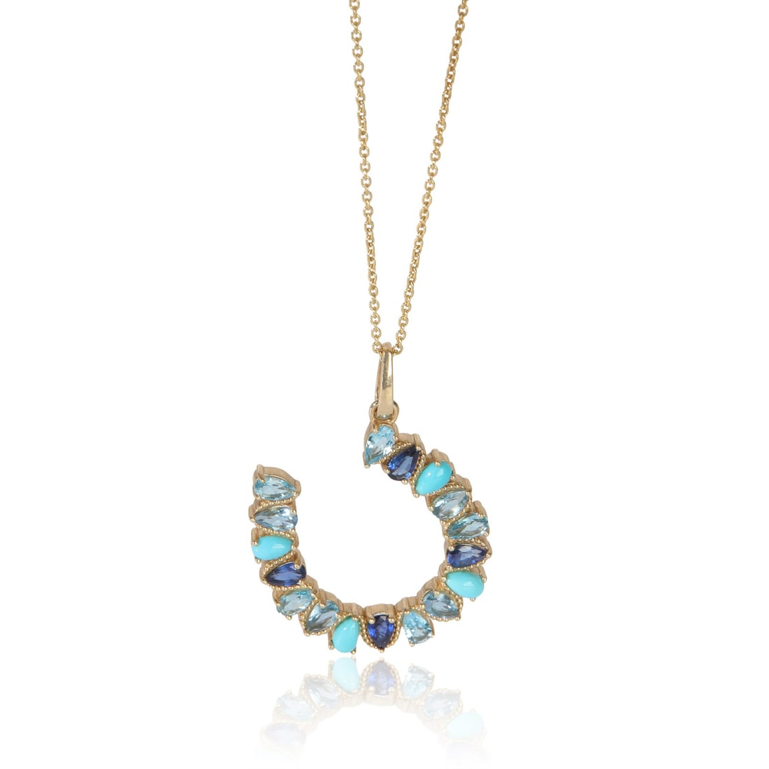 14K Yellow Gold Horseshoe Pendant with Blue Gemstone Accents: 14K Yellow Gold Horseshoe Pendant with Blue Gemstone Accents This women's pendant features a large horseshoe design crafted in 14K yellow gold. The piece belongs to the Large Mixed Blue Gemstone Horse