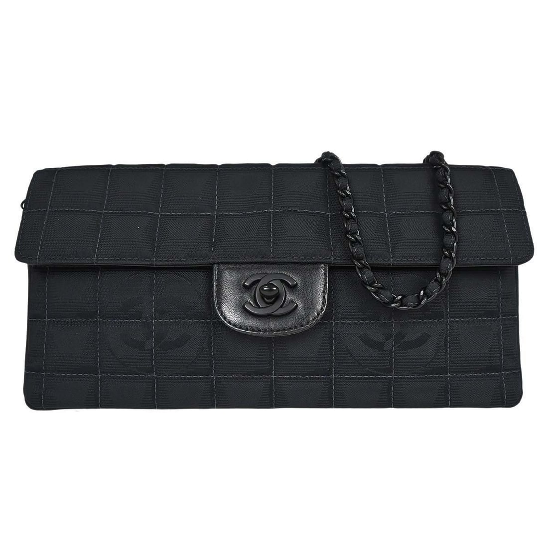 CHANEL East West Black Nylon Shoulder Bag Turn Lock: CHANEL East West Black Nylon Shoulder Bag Turn Lock This Chanel Black Jacquard Nylon Travel Line East West Shoulder Bag features a medium-sized silhouette crafted from durable nylon with a leather lin