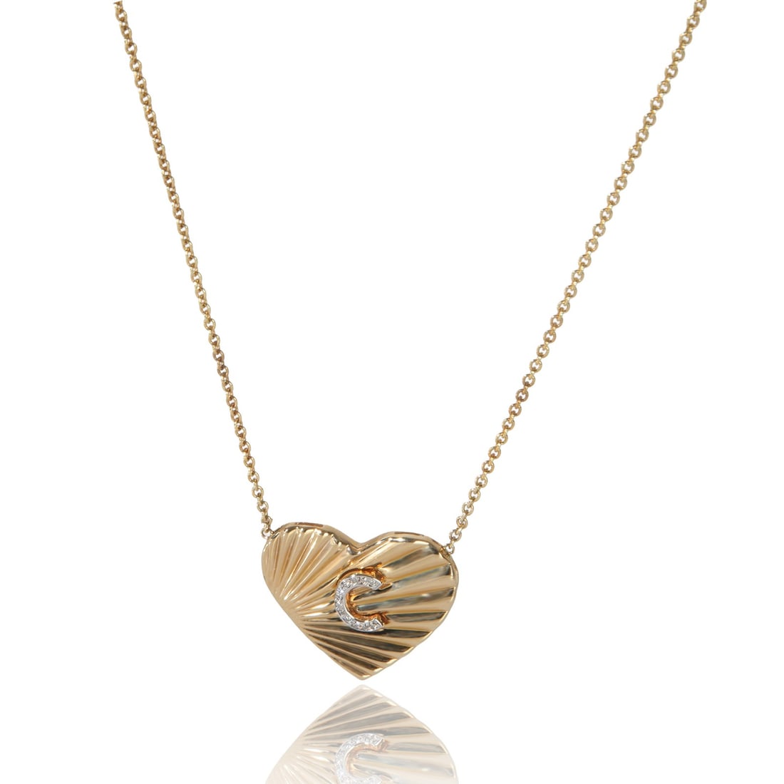 14K Yellow Gold Diamond Heart Pendant Featuring Letter C: 14K Yellow Gold Diamond Heart Pendant Featuring Letter C This pre-owned women's pendant features a heart-shaped design with the initial C, crafted in 14K yellow gold. The pendant is set with round bri