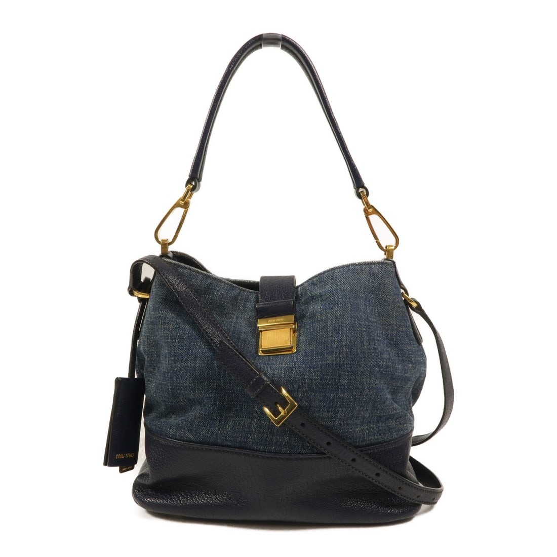 Miu Miu Denim Blue 2 Way Shoulder Bag GHW: Miu Miu Denim Blue 2 Way Shoulder Bag GHW This Miu Miu 2-way shoulder bag features a stylish denim exterior in blue, offering versatile wear as both a shoulder and handbag. Designed for women, it has 