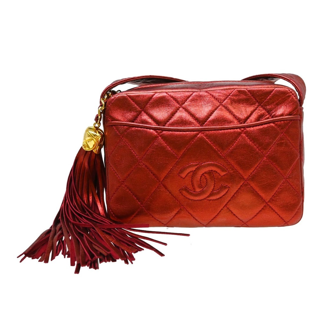 CHANEL Mini Red Lambskin Fringe Crossbody Bag: CHANEL Mini Red Lambskin Fringe Crossbody Bag This Chanel camera bag is crafted from luxurious red lambskin leather, featuring a compact mini size and a stylish crossbody strap. The bag is accented wi