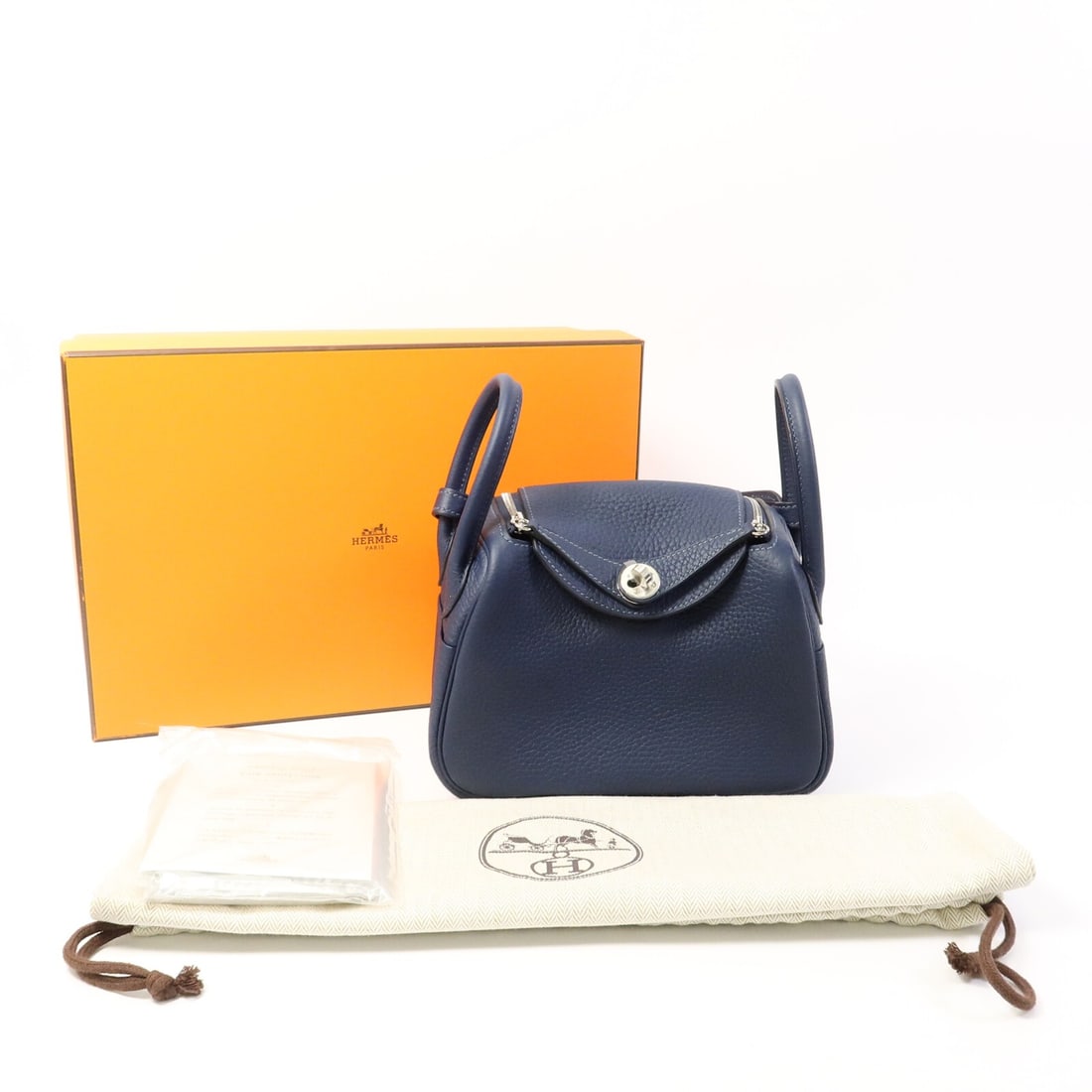 Hermes Mini Lindy Bleu De Prusse Calfskin 2Way Shoulder Bag: Hermes Mini Lindy Bleu De Prusse Calfskin 2Way Shoulder Bag This Hermes Mini Lindy 2-way shoulder bag is crafted from Clemence calfskin leather in a rich Bleu De Prusse color. It features a versatile 