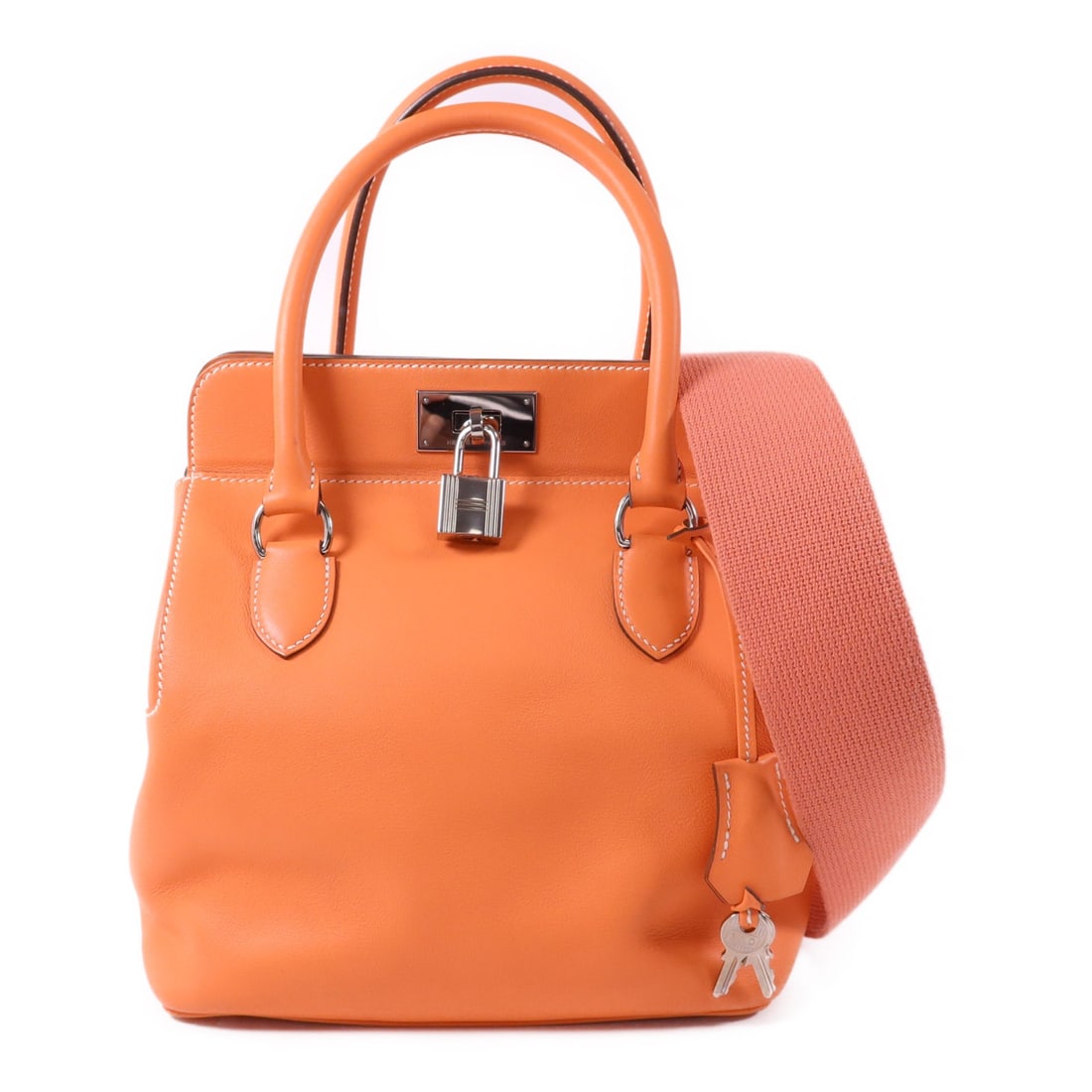 Hermes Toolbox 20 Swift Leather Orange Shoulder Bag Palladium Hardware: Hermes Toolbox 20 Swift Leather Orange Shoulder Bag Palladium Hardware This Hermes Tool Box 20 is a two-way shoulder bag crafted from Swift leather in a vibrant orange hue. Designed for women, it feat