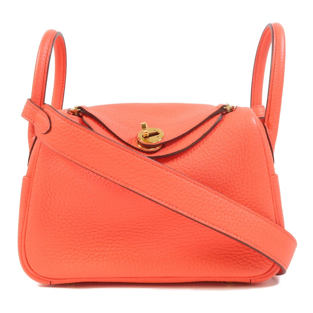 Hermes Mini Lindy Rose Texas Calfskin 2 Way Shoulder Bag: Hermes Mini Lindy Rose Texas Calfskin 2 Way Shoulder Bag This HERMES Mini Lindy 2 Way Shoulder Bag is crafted from high-quality Clemence calfskin leather in a striking Rose Texas red hue. Made in Fran