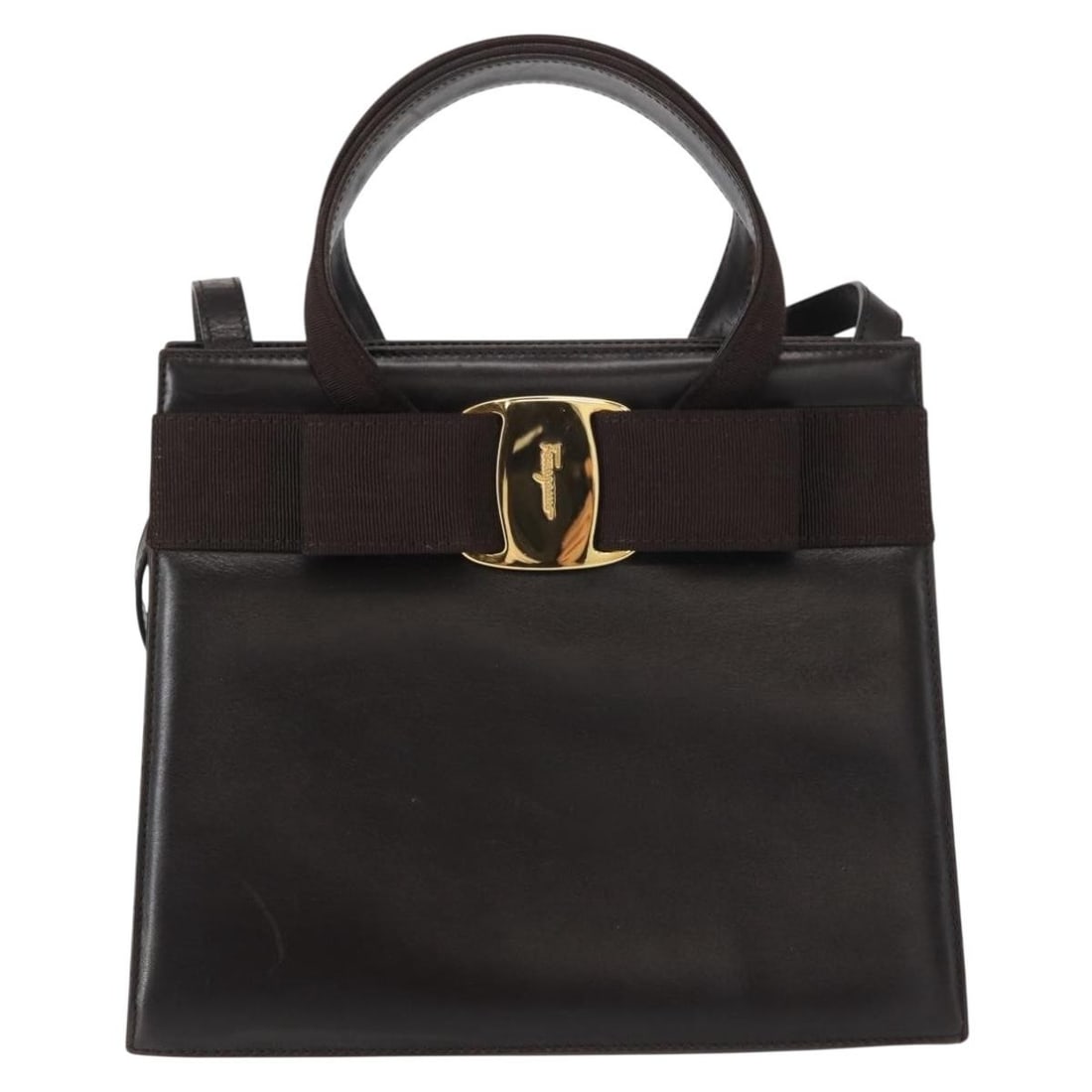 Vara Bow Convertible Brown Leather Tote by Salvatore Ferragamo: Vara Bow Convertible Brown Leather Tote by Salvatore Ferragamo This Salvatore Ferragamo Convertible Vara Bow Tote is crafted from brown leather and designed for women. It features both handles and a s