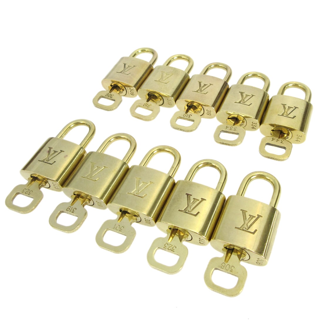 Louis Vuitton gold padlock charm set of 10 with keys: Louis Vuitton gold padlock charm set of 10 with keys This is a Louis Vuitton padlock and key bag accessory set in gold tone, originating from France. The set includes ten individual pieces, each featu