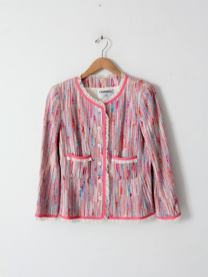 Colorful Vintage Chanel Tweed Jacket with Ruffle Details: Colorful Vintage Chanel Tweed Jacket with Ruffle Details This Vintage Chanel Jacket is a vibrant reinterpretation of the iconic Chanel tweed design, expertly crafted with luxurious materials including