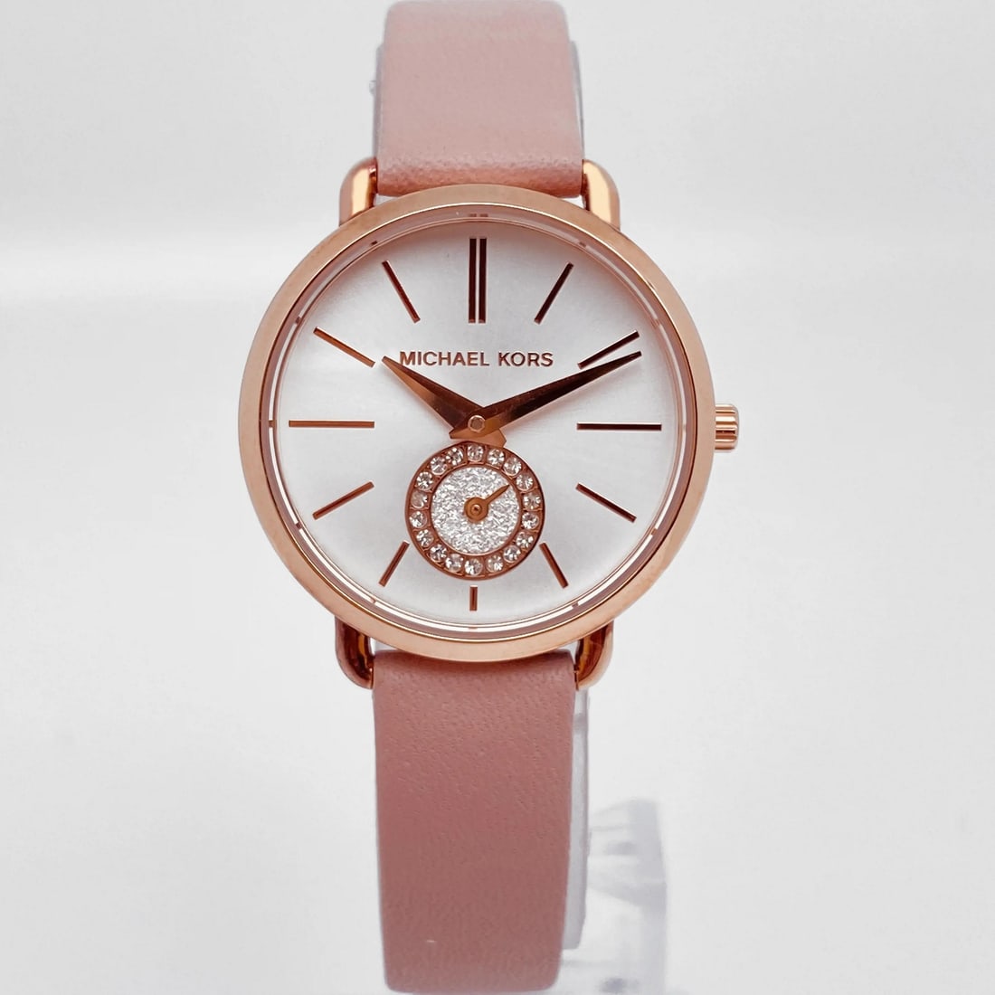 Michael Kors Petite Portia 28mm Quartz Watch MK2735 Pink Gold Dial Leather Strap: Michael Kors Petite Portia 28mm Quartz Watch MK2735 Pink Gold Dial Leather Strap Presenting the Michael Kors Petite Portia 28mm Ladies Quartz Watch MK2735, a stylish blend of elegance and functionalit