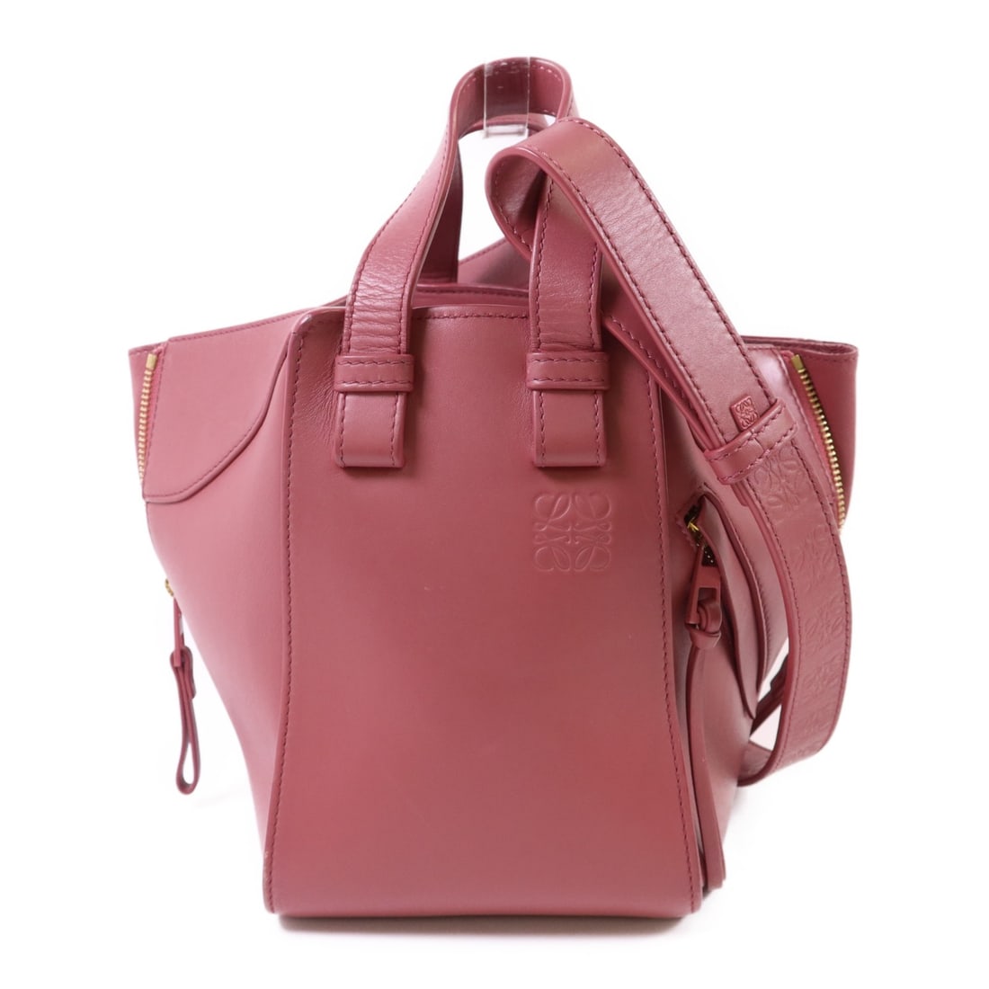 LOEWE Pink Calfskin Leather Hammock Small 2 Way Shoulder Bag: LOEWE Pink Calfskin Leather Hammock Small 2 Way Shoulder Bag Introducing the LOEWE Hammock Small 2 Way Shoulder Bag, crafted from luxurious calfskin leather in a charming pink hue. This versatile bag 