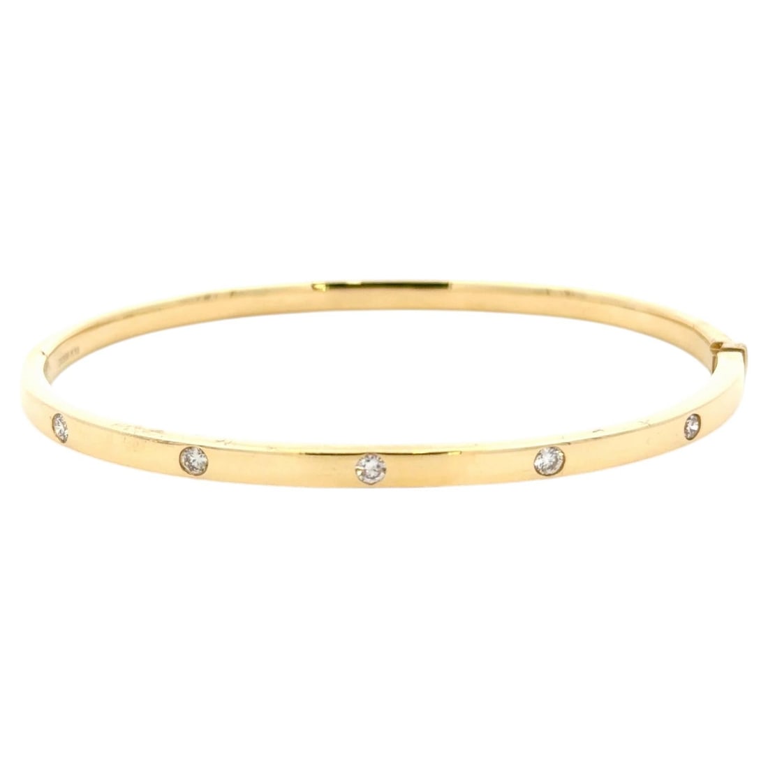 Oval 18K Yellow Gold Bangle with Five Diamonds: Oval 18K Yellow Gold Bangle with Five Diamonds This elegant oval bangle bracelet is crafted from 18K yellow gold and features five round brilliant-cut diamonds with a total weight of approximately 0.2