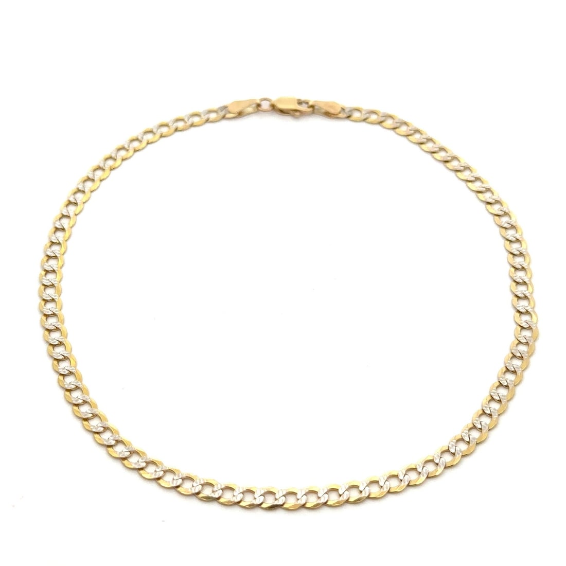 10k Yellow White Gold 10 Inch Diamond Cut Cuban Link Anklet: 10k Yellow White Gold 10 Inch Diamond Cut Cuban Link Anklet This exquisite anklet features a stunning design crafted from solid 10k yellow gold, complemented by a white gold diamond cut finish. The cu