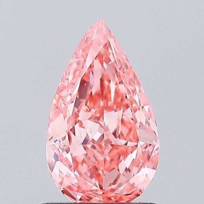 Loose Diamond - PEAR 0.98ct Fancy Vivid Pink VS1: Loose Diamond - PEAR 0.98ct Fancy Vivid Pink VS1 Source: This is a real non-mined Diamond that has been grown in a lab Shape: PEAR Carats: 0.98 Color: Fancy Vivid Pink Certification: IGI Video: