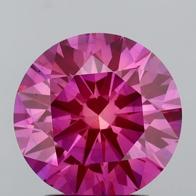 Ideal Loose Diamond - ROUND 2.1ct Fancy Vivid Pink VS2: Ideal Loose Diamond - ROUND 2.1ct Fancy Vivid Pink VS2 Source: This is a real non-mined Diamond that has been grown in a lab Shape: ROUND Carats: 2.1 Color: Fancy Vivid Pink Certification: IGI Video: