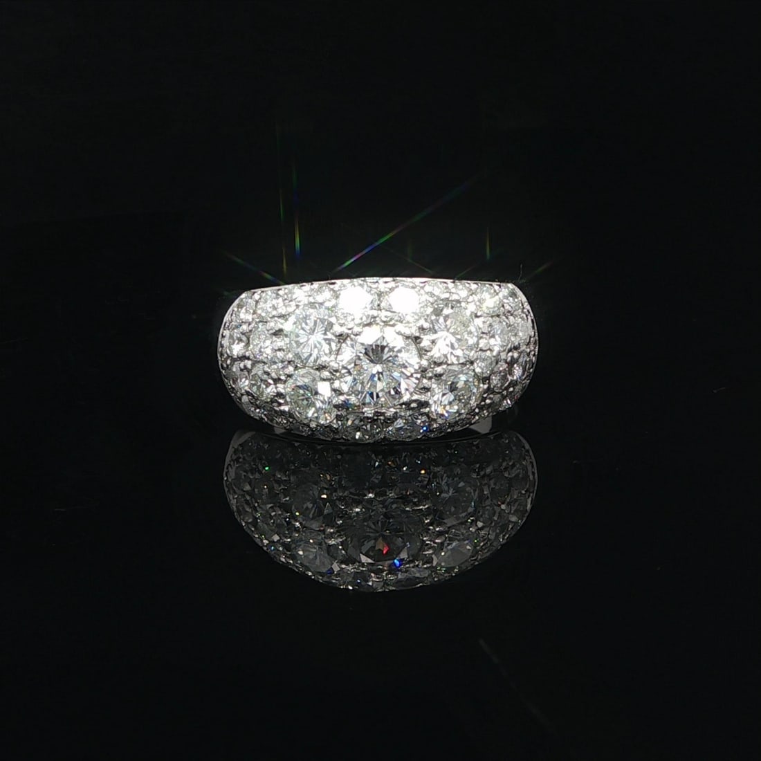 Domed Platinum Band Ring with 2.23ctw Round Pave Diamonds: Domed Platinum Band Ring with 2.23ctw Round Pave Diamonds This platinum domed band ring features 2.23 carats total weight of large, natural, brilliant-cut white diamonds in a graduating round pave set