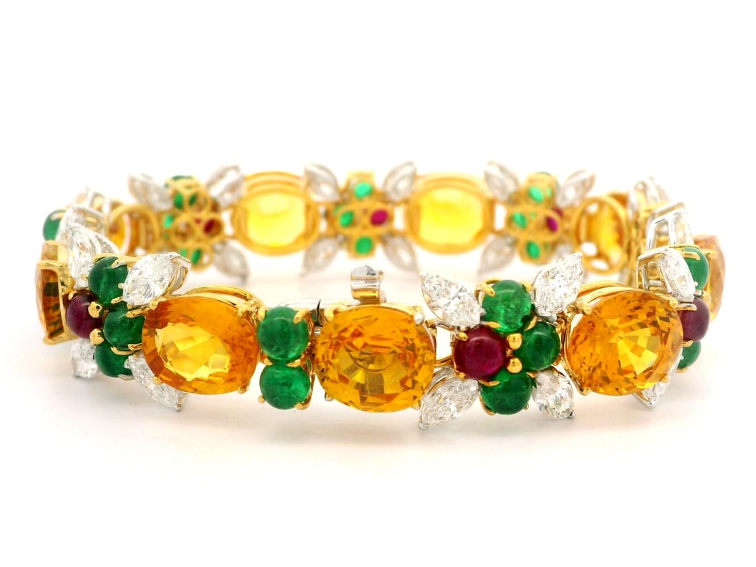 GIA Certified 64.44ctw Sapphire Emerald Ruby Diamond Bracelet in Platinum Gold: GIA Certified 64.44ctw Sapphire Emerald Ruby Diamond Bracelet in Platinum Gold This exquisite statement bracelet features a stunning combination of natural gemstones set in solid platinum and yellow g