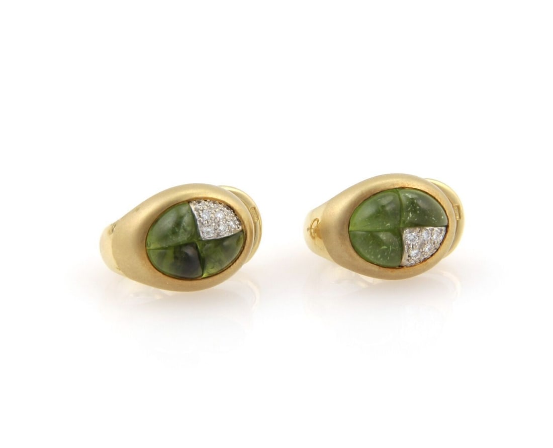 Pomellato huggie earrings 18k yellow gold green tourmaline diamonds: Pomellato huggie earrings 18k yellow gold green tourmaline diamonds These Pomellato huggie earrings are expertly crafted in 18k yellow gold and feature vibrant green tourmalines complemented by sparkl