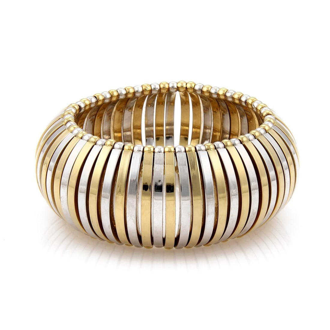 Brevettato 18k Yellow White Gold Open Dome 34mm Bangle Bracelet: Brevettato 18k Yellow White Gold Open Dome 34mm Bangle Bracelet Introducing an exquisite designer bracelet from Brevettato, showcasing a stunning combination of 18k yellow and white gold in a high-pol