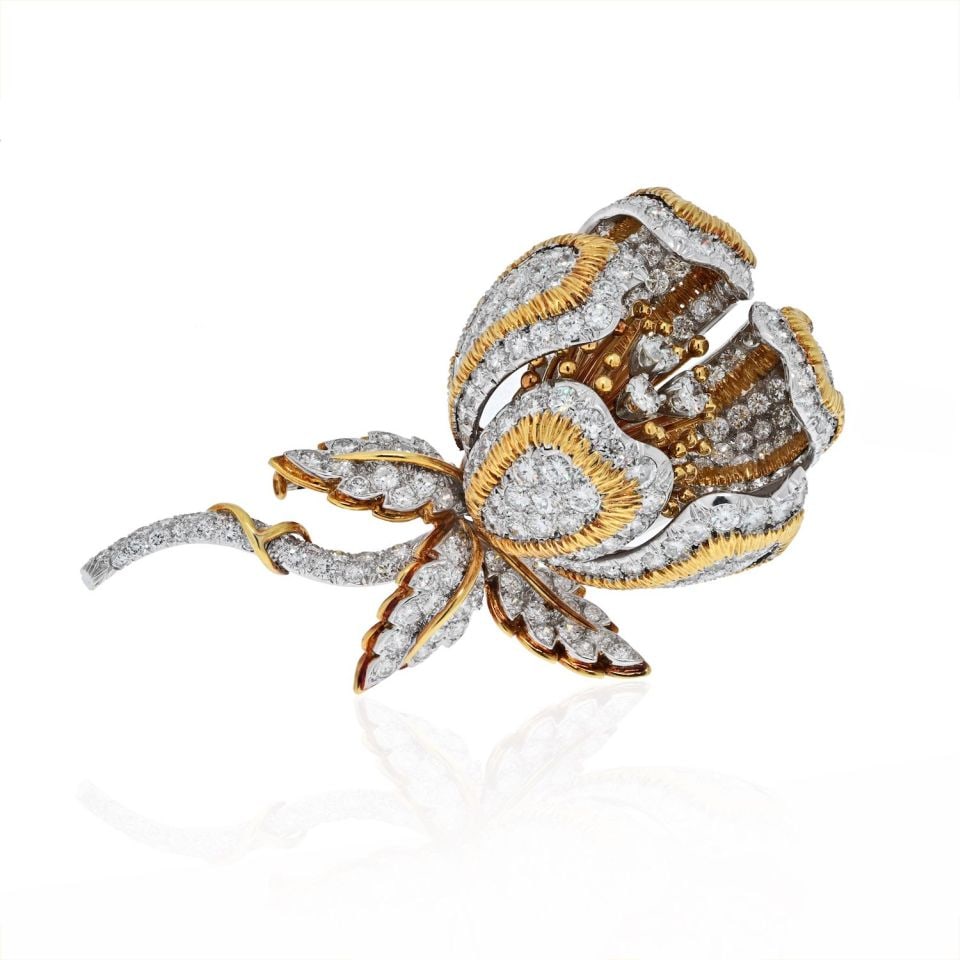 David Webb Platinum 18K Gold 20 Carat Diamond Flower Brooch: David Webb Platinum 18K Gold 20 Carat Diamond Flower Brooch This exquisite David Webb brooch is a stunning representation of artistry, crafted from platinum and 18K yellow gold. Featuring a remarkable