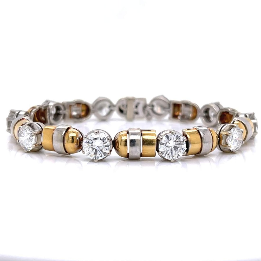 Stunning 18K Gold Diamond Bracelet 14.00 Ct VVS-VS F-G Color: Stunning 18K Gold Diamond Bracelet 14.00 Ct VVS-VS F-G Color This exquisite 18K Yellow and White Gold Diamond Bracelet showcases a stunning design adorned with 10 diamonds, boasting a total weight of 