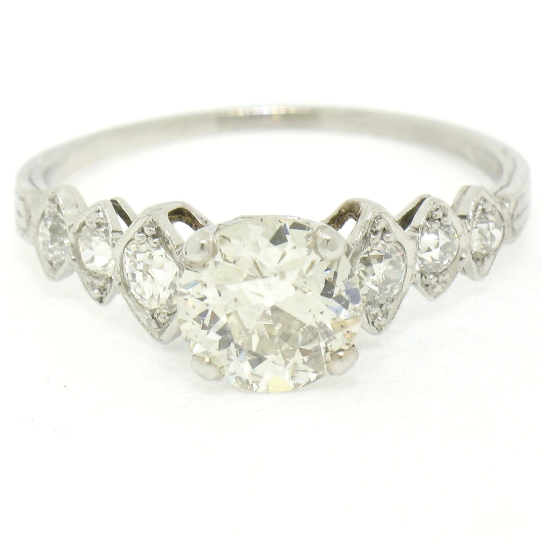 Antique Art Deco Platinum 1.83ctw Old European Cut Diamond Ring: Antique Art Deco Platinum 1.83ctw Old European Cut Diamond Ring This exquisite Antique Art Deco Platinum Ring features a stunning graduated design adorned with Old European Cut diamonds. The centerpie