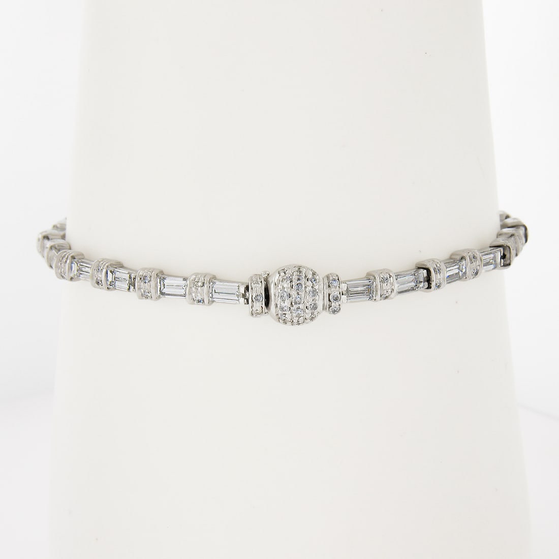 French 18k White Gold 4.09ctw Diamond Tennis Bracelet with Push Lock: French 18k White Gold 4.09ctw Diamond Tennis Bracelet with Push Lock Elevate your jewelry collection with this stunning French 18k White Gold Bracelet featuring a dazzling combination of 101 natural d
