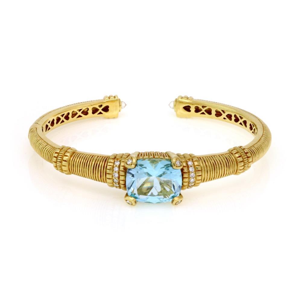 Judith Ripka 18k Yellow Gold Cuff Bracelet Blue Topaz Diamonds JR 18k: Judith Ripka 18k Yellow Gold Cuff Bracelet Blue Topaz Diamonds JR 18k This exquisite cuff bangle bracelet by Judith Ripka is a stunning piece of jewelry. Crafted from luxurious 18k yellow gold, it fea