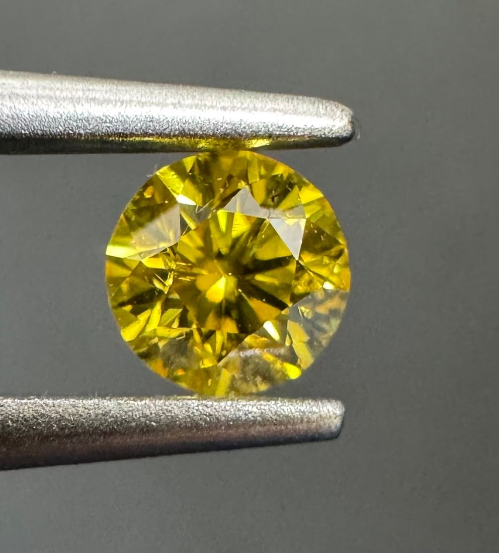 Loose Diamond - ROUND 0.24ct Fancy Vivid Yellow I1: Loose Diamond - ROUND 0.24ct Fancy Vivid Yellow I1 Source: Natural Shape: ROUND Carats: 0.24 Color: Fancy Vivid Yellow Certification: GIA PLEASE NOTE: Framed, Large, or heavy items do not have shippin
