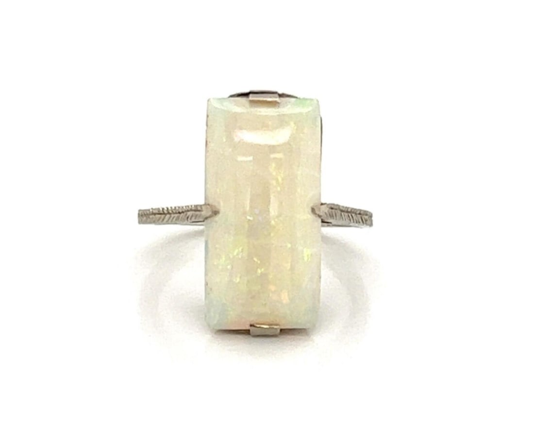 Vintage Estate 18k White Gold Opal Solitaire Ring Size 3.5: Vintage Estate 18k White Gold Opal Solitaire Ring Size 3.5 This antique opal solitaire ring is crafted in 18k white gold and features a striking opal centerpiece measuring approximately 16.4mm by 8.6m