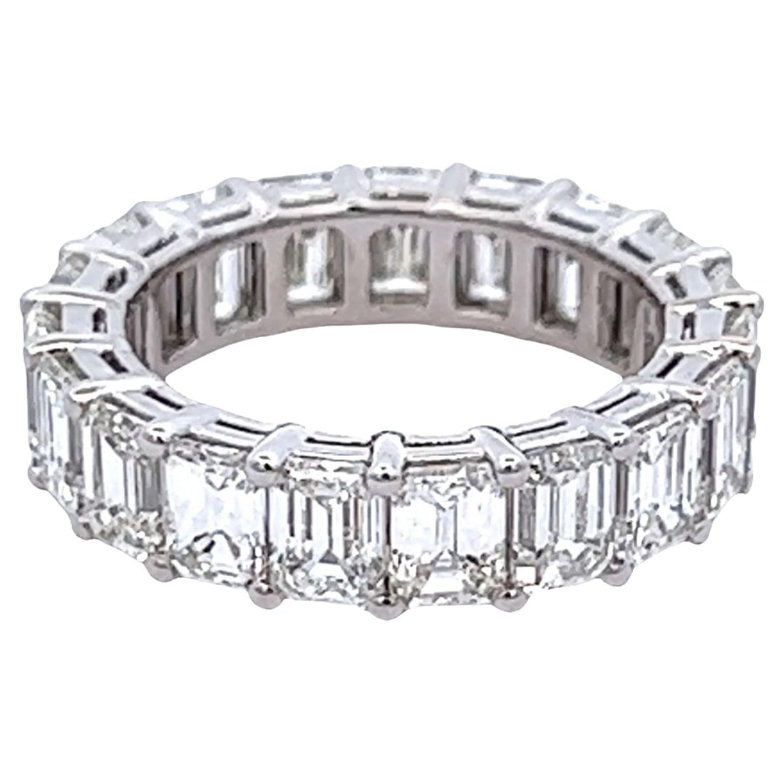 6.47ct Emerald Cut Diamond Eternity Band 18k White Gold: 6.47ct Emerald Cut Diamond Eternity Band 18k White Gold This stunning emerald cut diamond eternity band features 19 exquisite emerald cut diamonds totaling 6.47 carats. Crafted in 18k white gold, this