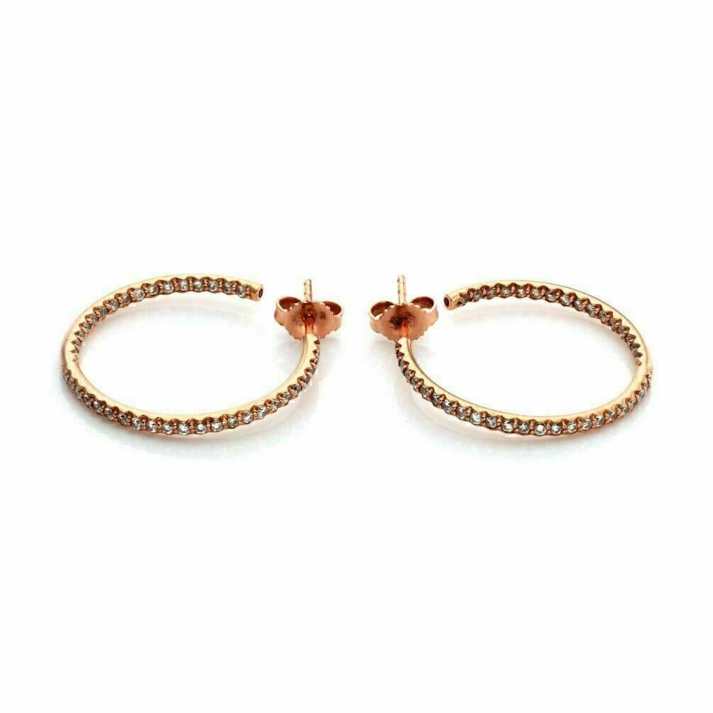 Roberto Coin 18k Rose Gold Diamond Inside Out Hoop Earrings: Roberto Coin 18k Rose Gold Diamond Inside Out Hoop Earrings These authentic Roberto Coin hoop earrings are expertly crafted in 18k rose gold, featuring a slim inside-out design adorned with approximat